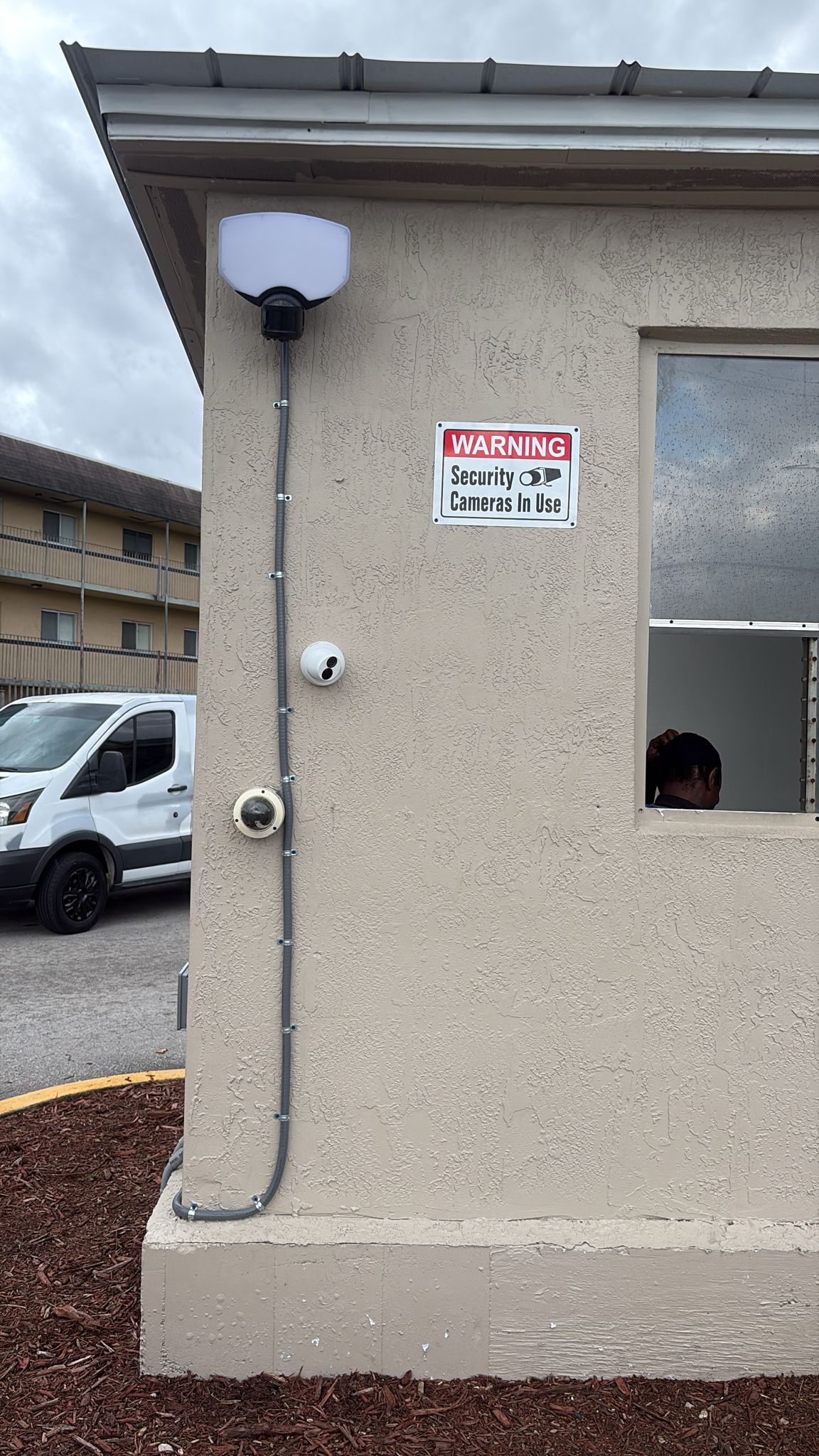Security kiosk at Glorieta Gardens with multiple exterior camera types and dedicated lighting